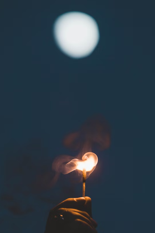 using a match to light a fire